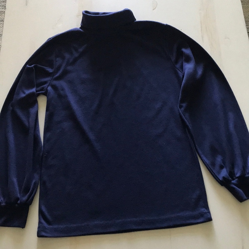 Club House turtleneck.